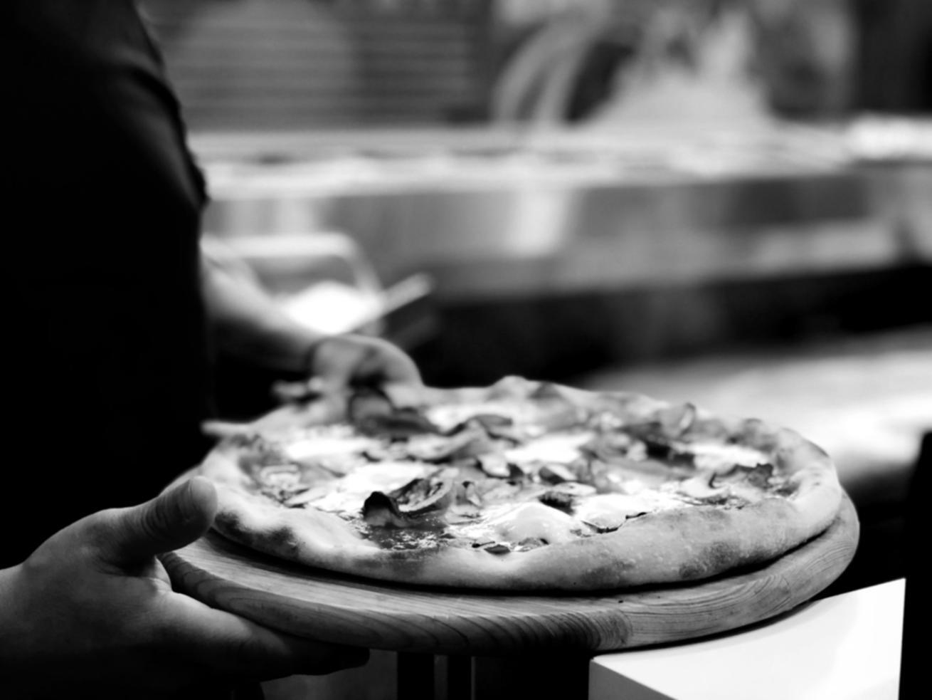 Artisan pizza with quality ingredients prepared using traditional methods
